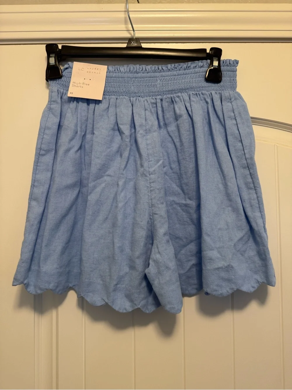LC Lauren Conrad Super High Rise Smocked Scalloped Shorts in a light blue color
